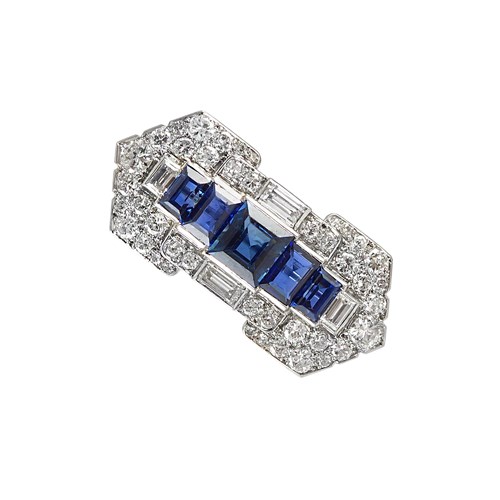 Art Deco sapphire and diamond geometric brooch by Cartier, Paris for Cartier New York c.1927, the oblong panel of stepped design with arrowed ends,